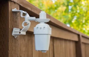 Rain Bird WR2 Wireless Irrigation Rain Sensor Mounted on Fence
